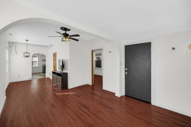 a view of a living room with wooden floor