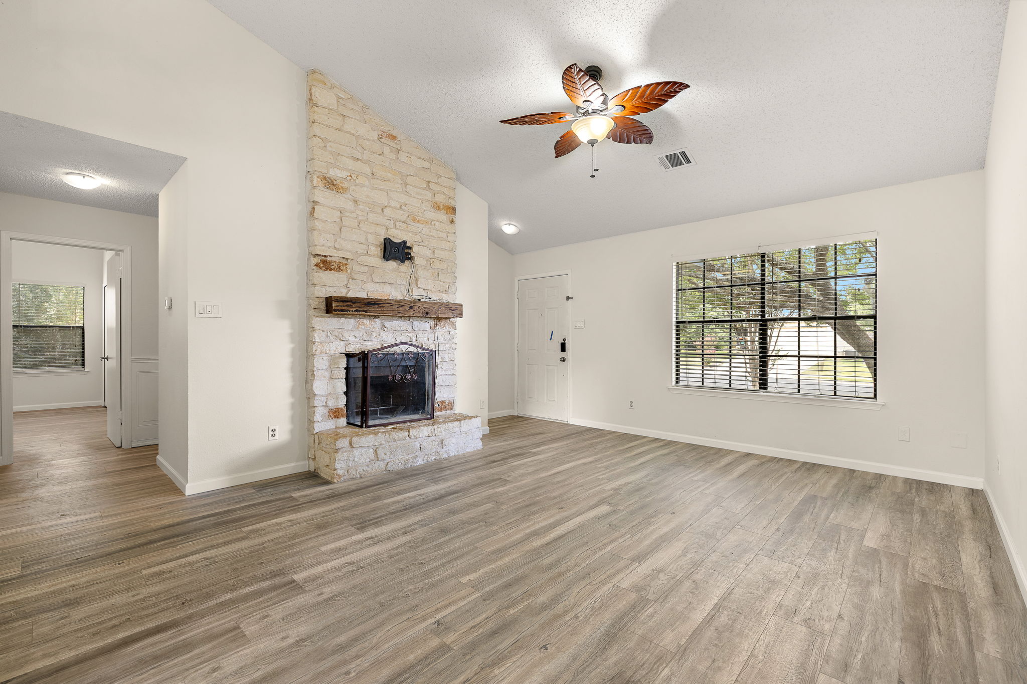 1705 Laurel Path Round Rock, TX 78664 - Photo 4 of 17 The living room features high ceilings and a fireplace.