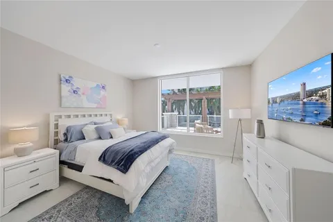 a dining room with furniture and a floor to ceiling window