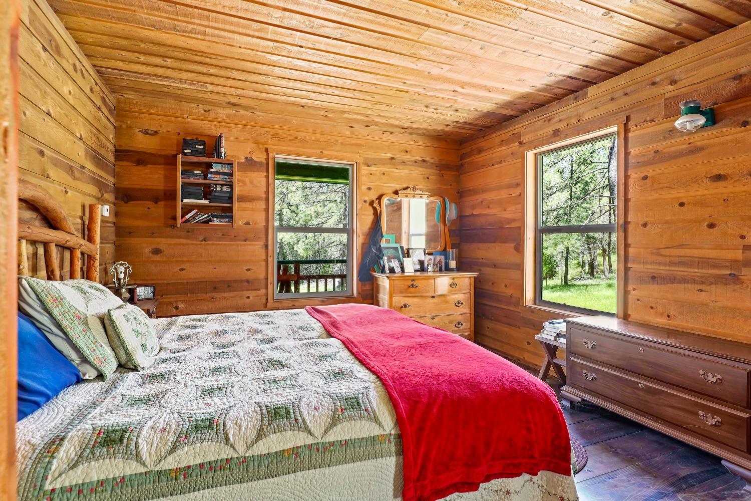 7744 Swiss Ranch Road Mountain Ranch, CA 95246 - Photo 28 of 64 a bed sitting in a bedroom next to a window