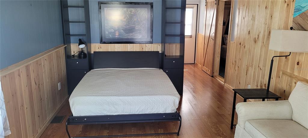 4421 Lane Road, Unit 216B Zephyrhills, FL 33541 - Photo 16 of 22 a bed sitting in a bedroom next to a window