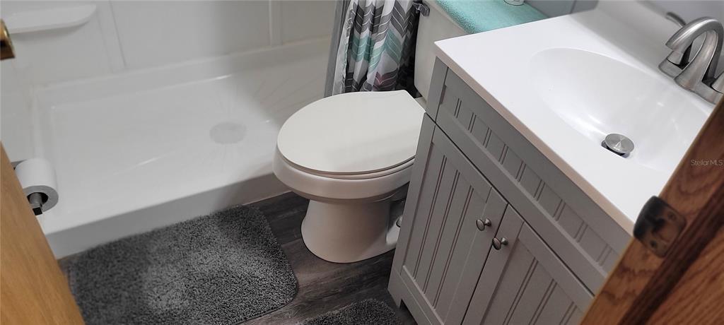 4421 Lane Road, Unit 216B Zephyrhills, FL 33541 - Photo 17 of 22 a bathroom with a sink and a mirror