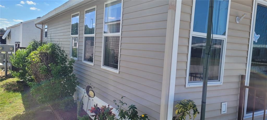 4421 Lane Road, Unit 216B Zephyrhills, FL 33541 - Photo 3 of 22 a view of front door and porch