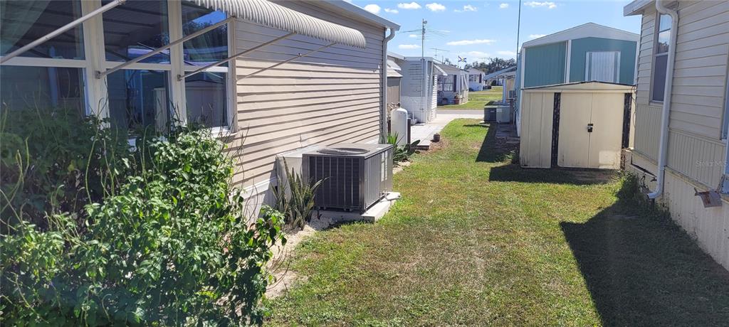 4421 Lane Road, Unit 216B Zephyrhills, FL 33541 - Photo 4 of 22 a view of a back yard of the house