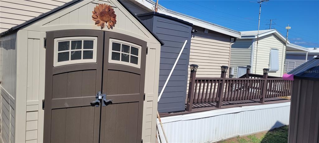 4421 Lane Road, Unit 216B Zephyrhills, FL 33541 - Photo 5 of 22 a view of a house with wooden fence