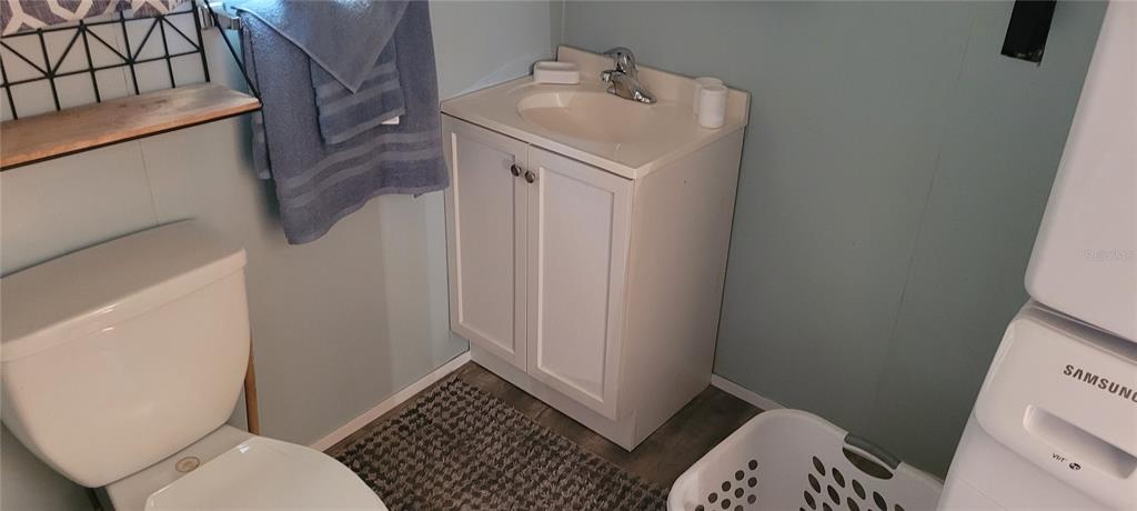 4421 Lane Road, Unit 216B Zephyrhills, FL 33541 - Photo 9 of 22 a bathroom with a sink toilet and shower