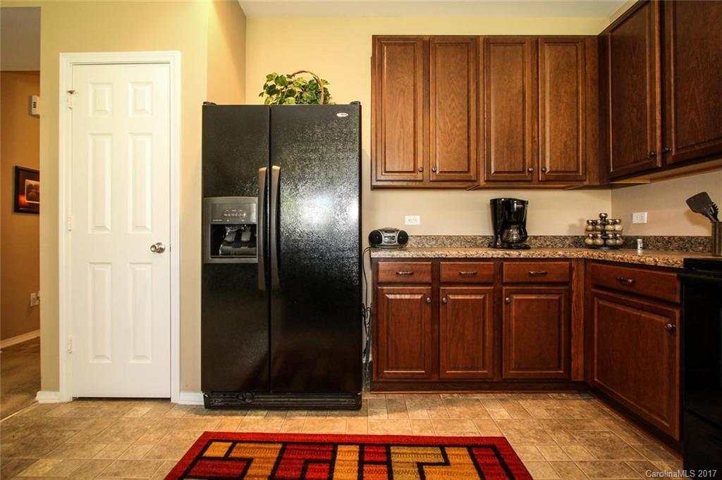 219 River Clay Road Fort Mill, SC 29708 - Photo 14 of 24 a kitchen with stainless steel appliances granite countertop a refrigerator and a sink