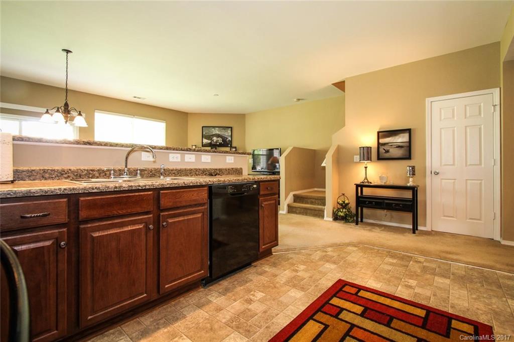 219 River Clay Road Fort Mill, SC 29708 - Photo 15 of 24 a kitchen with granite countertop a sink and cabinets