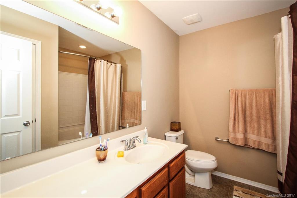 219 River Clay Road Fort Mill, SC 29708 - Photo 21 of 24 a bathroom with a sink a toilet and a mirror
