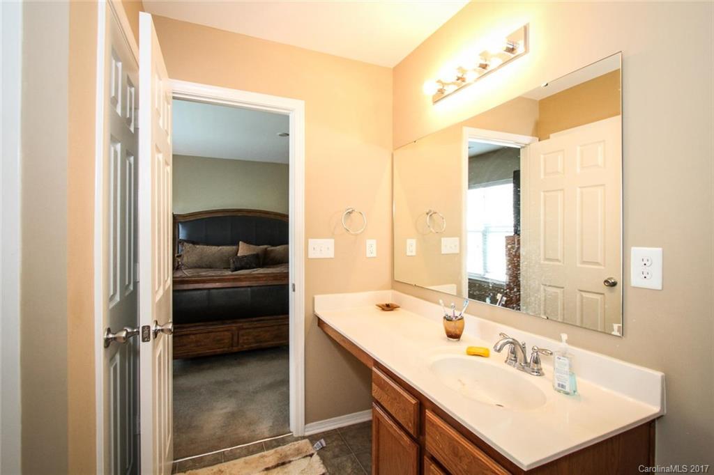 219 River Clay Road Fort Mill, SC 29708 - Photo 22 of 24 a en suite bathroom with a tub sink and mirror