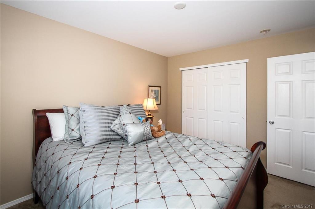 219 River Clay Road Fort Mill, SC 29708 - Photo 24 of 24 a bedroom with a bed and wooden floor