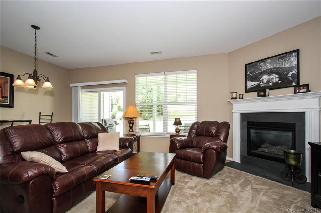 219 River Clay Road Fort Mill, SC 29708 - Photo 5 of 24 a living room with furniture a window and a fireplace