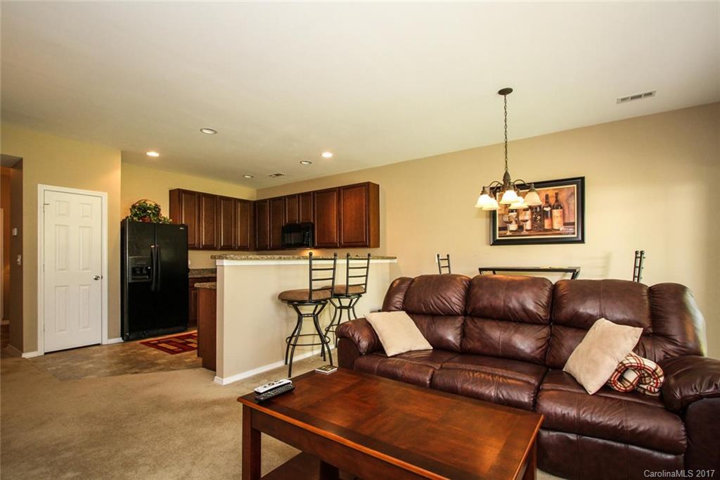 219 River Clay Road Fort Mill, SC 29708 - Photo 7 of 24 a living room with furniture a refrigerator and a table