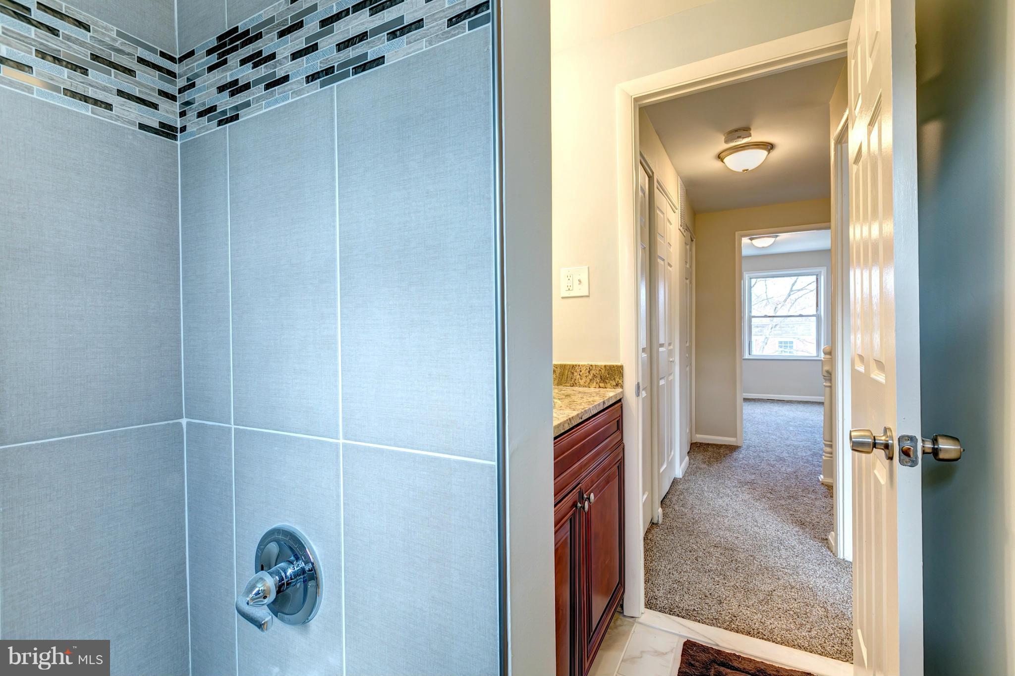 5581 Whitby Road Baltimore, MD 21206 - Photo 17 of 29 Bath With Custom Tile
