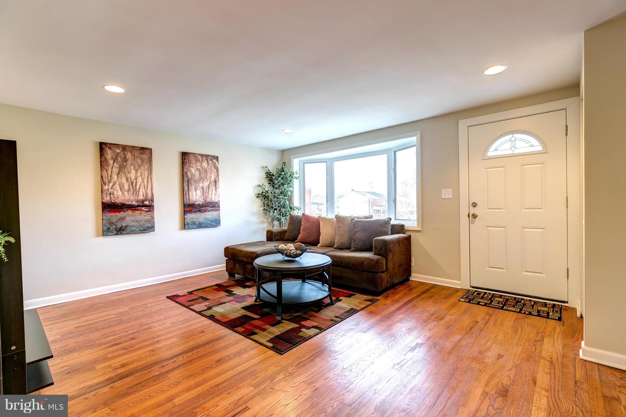 5581 Whitby Road Baltimore, MD 21206 - Photo 5 of 29 Living Room With Bay Windows