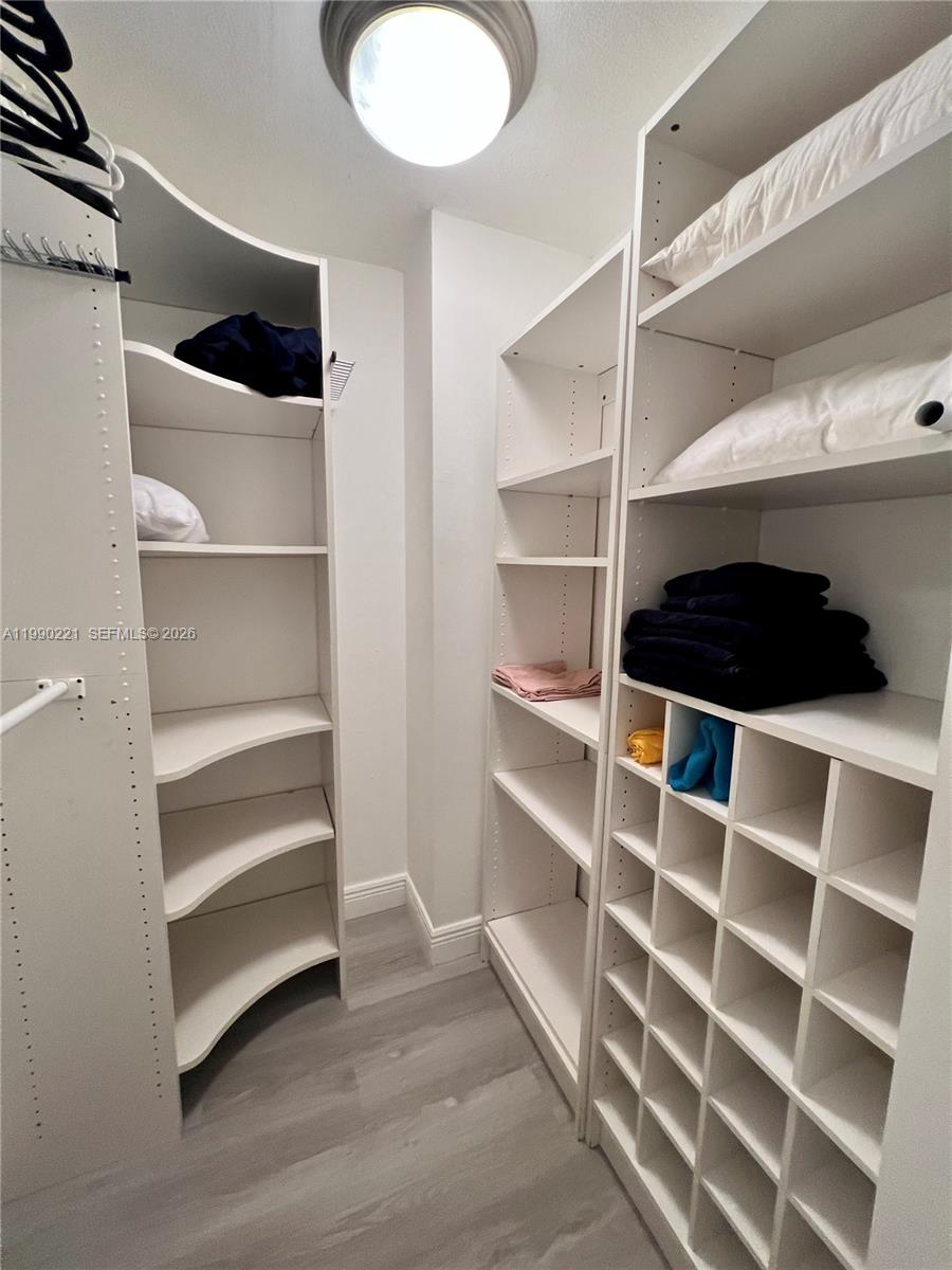 8233 Harding Avenue, Unit 204 Miami Beach, FL 33141 - Photo 14 of 18 a view of walk in closet with empty racks