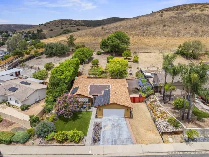 an aerial view of a house with lots of trees