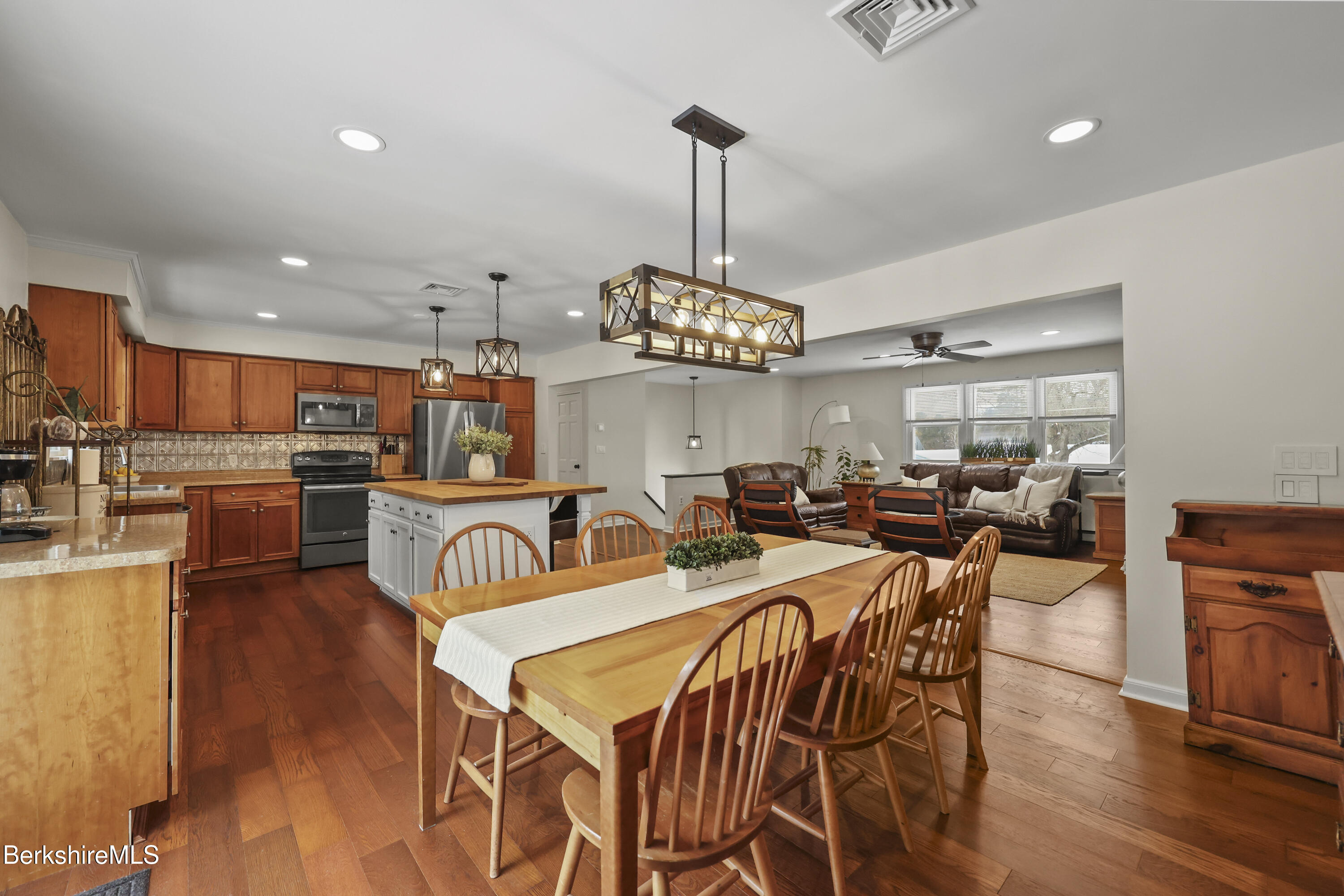 83 Alfred Drive Pittsfield, MA 01201 - Photo 15 of 49 a view of a dining room and livingroom with furniture wooden floor a chandelier