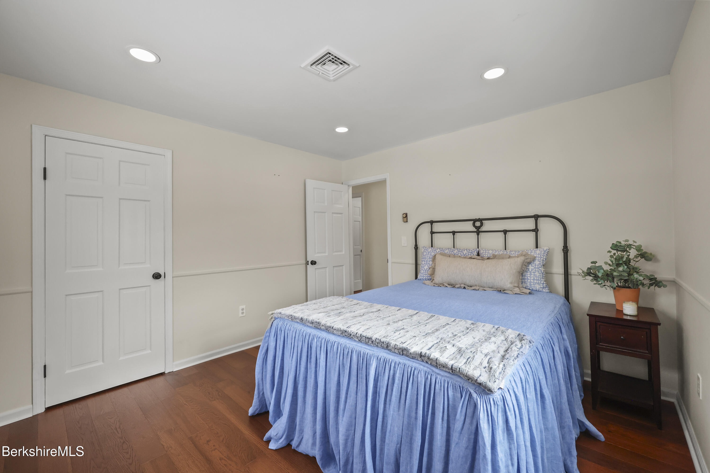 83 Alfred Drive Pittsfield, MA 01201 - Photo 25 of 49 a bedroom with a bed and wooden floor