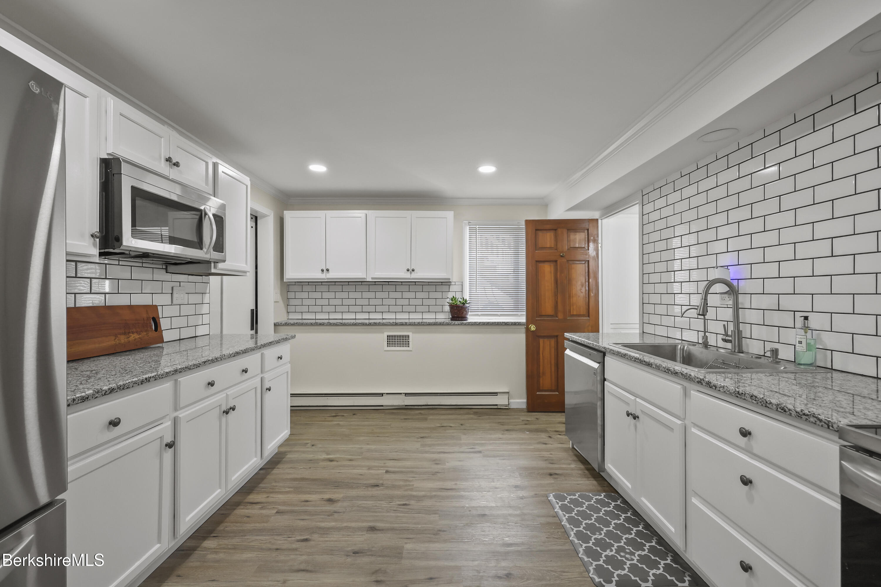 83 Alfred Drive Pittsfield, MA 01201 - Photo 34 of 49 a large kitchen with stainless steel appliances granite countertop a stove a sink and a granite counter tops