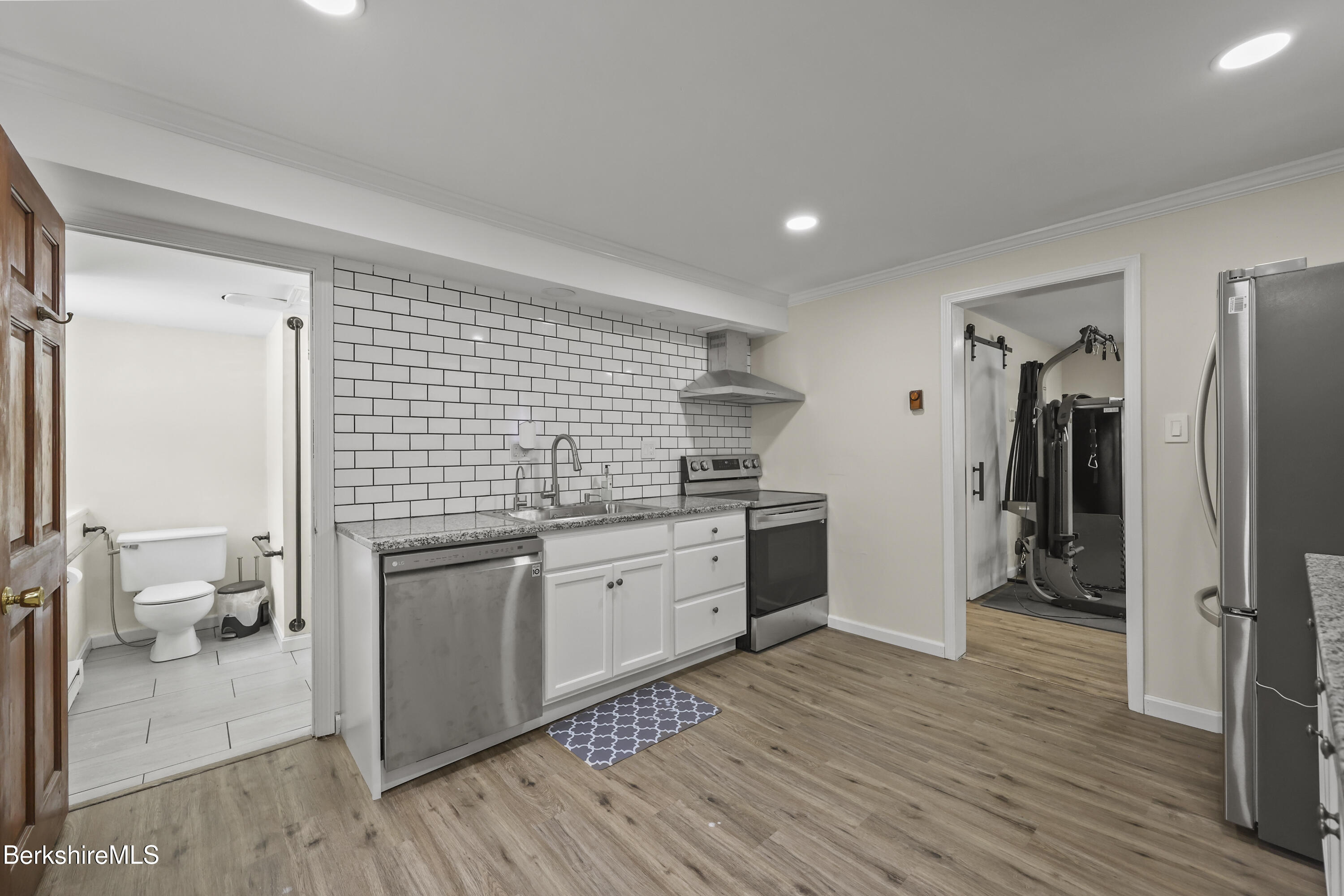 83 Alfred Drive Pittsfield, MA 01201 - Photo 40 of 49 a kitchen with stainless steel appliances granite countertop a refrigerator and a stove top oven