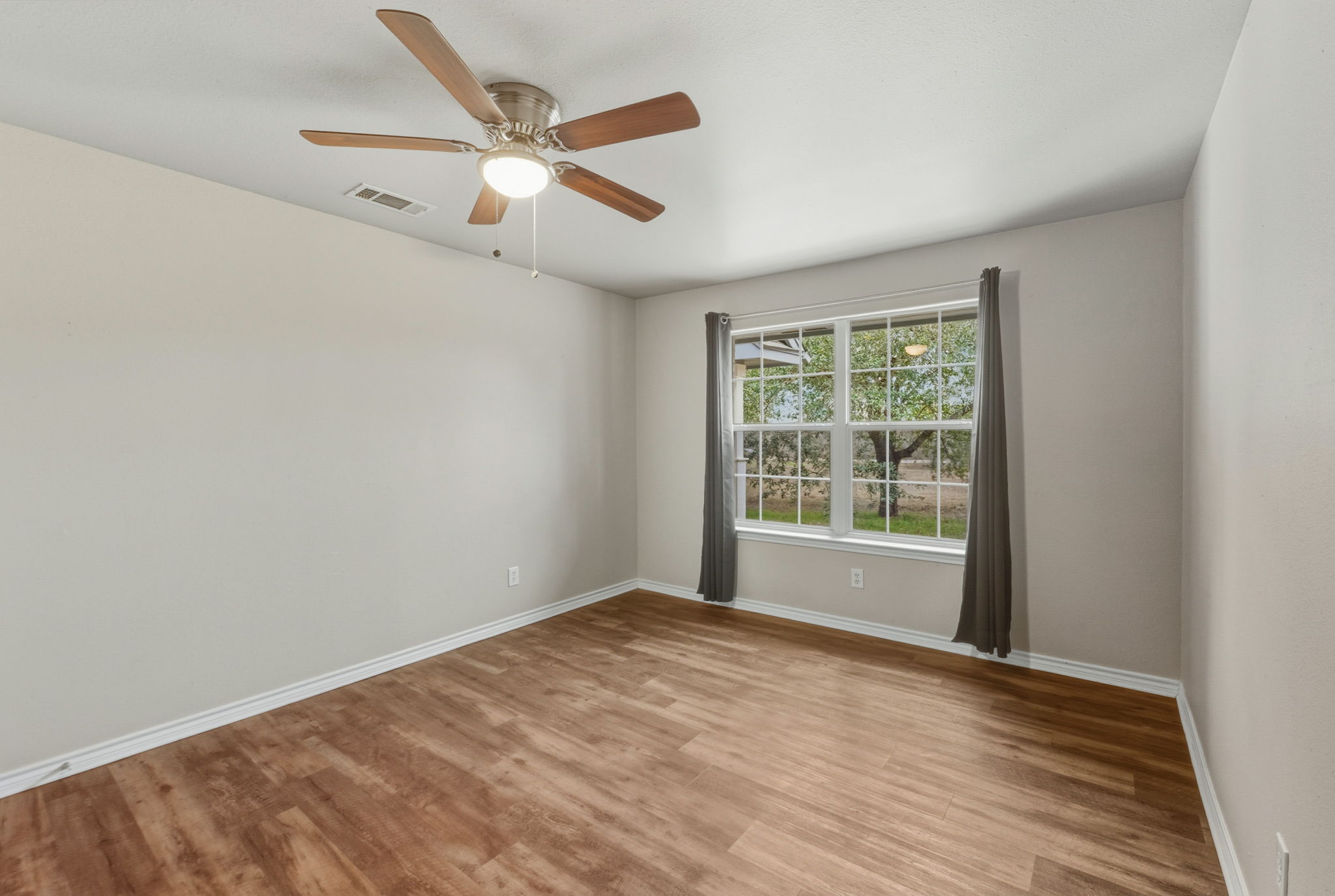 20808 Sandy Brown Lane Webberville, TX 78621 - Photo 27 of 40 Fourth Bedroom Equipped with a Ceiling Fan