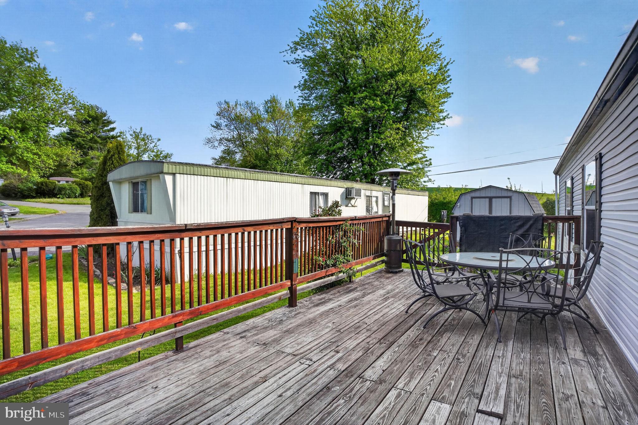 39 Country Club Road West Northampton, PA 18067 - Photo 17 of 26 a view of a chairs and table on the wooden deck
