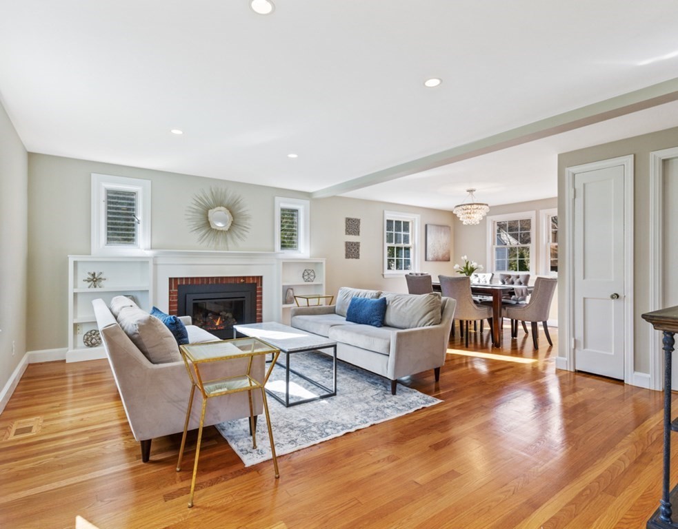 4 Park Street Lexington, MA 02421 - Photo 3 of 24 a living room with fireplace furniture and a wooden floor
