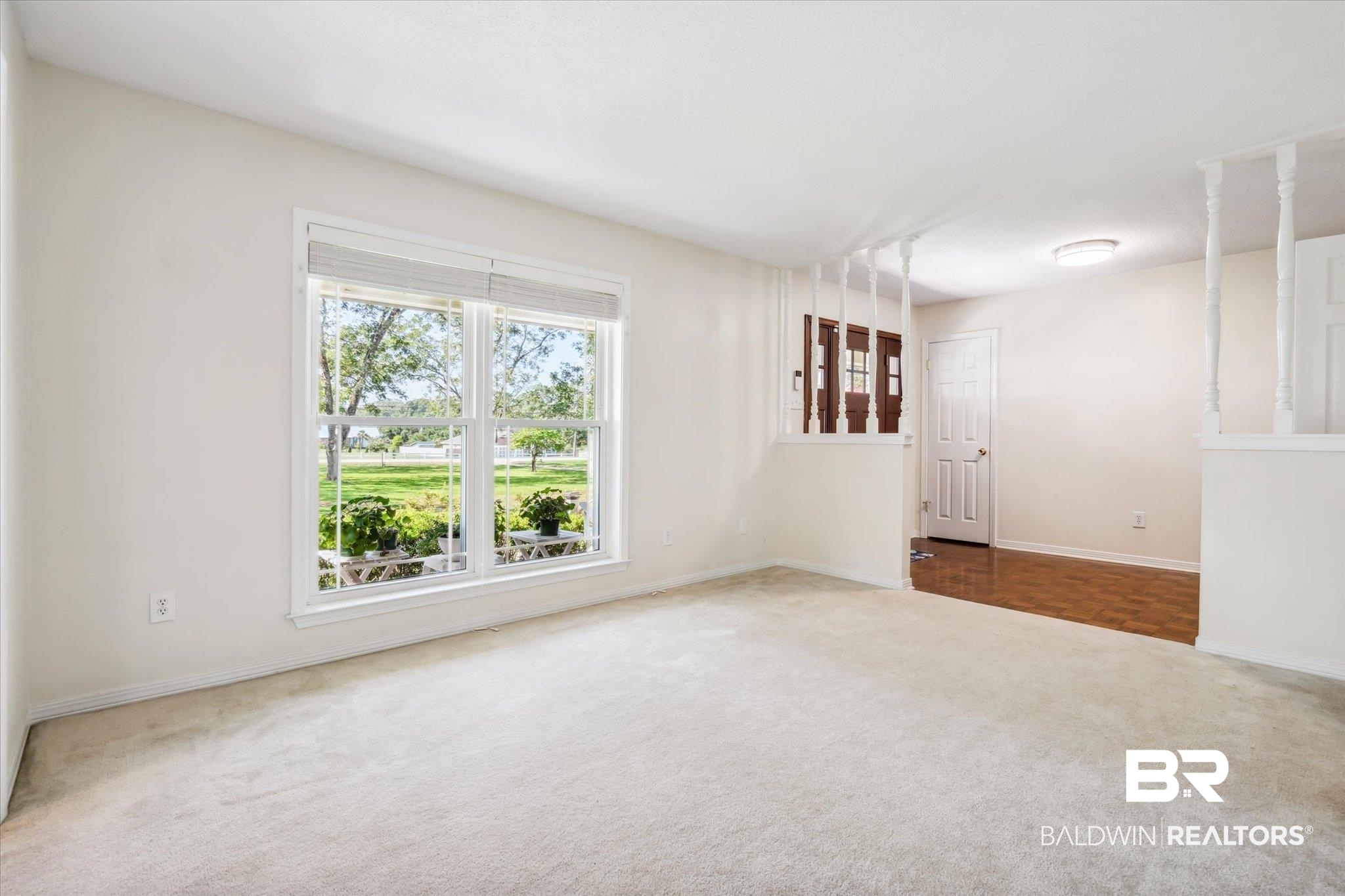 8710 Three Notch Road Mobile, AL 36619 - Photo 10 of 30 Unfurnished room with plenty of natural light and parquet floors