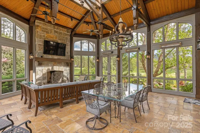 a dining room with furniture water view and a flat screen tv