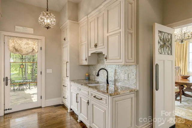 a kitchen with stainless steel appliances granite countertop a granite counter tops and a window