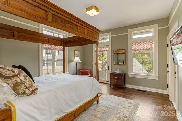 a bedroom with a bed dresser and a window