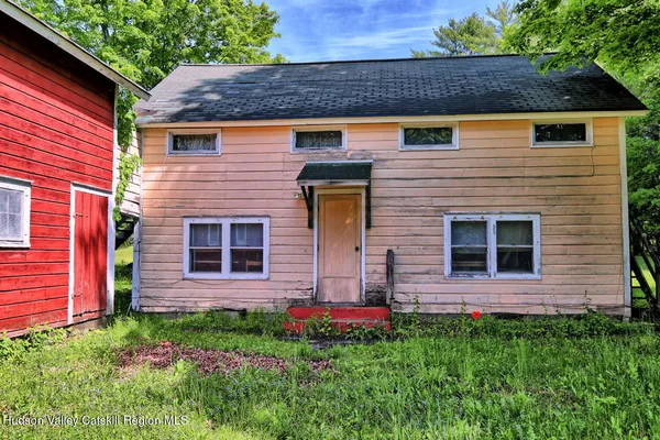 a living room with fireplace furniture and a flat screen tv