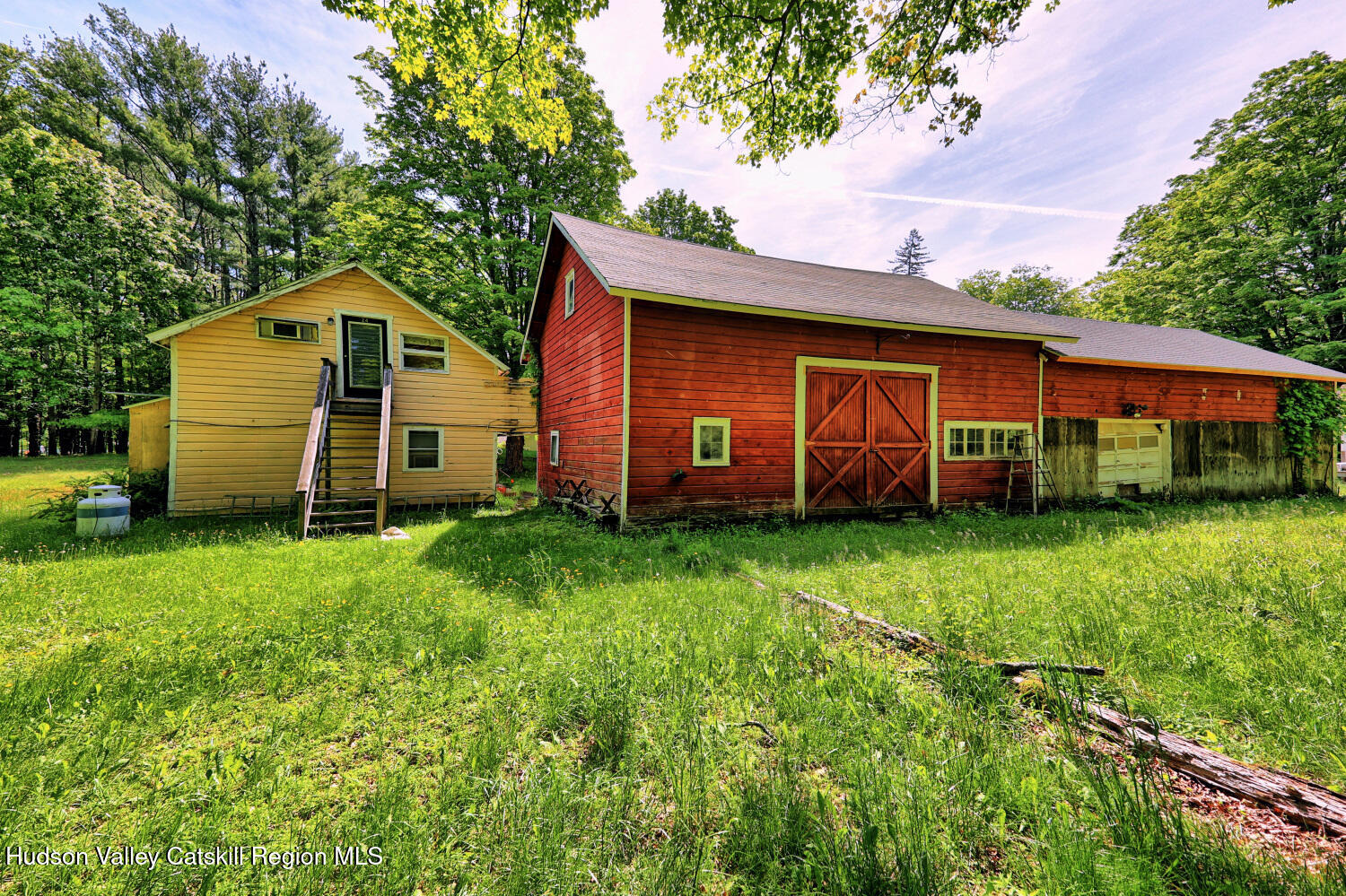 49 County Rte 39 Cairo, NY 12473 - Photo 21 of 114 a view of a barn in the middle of a yard