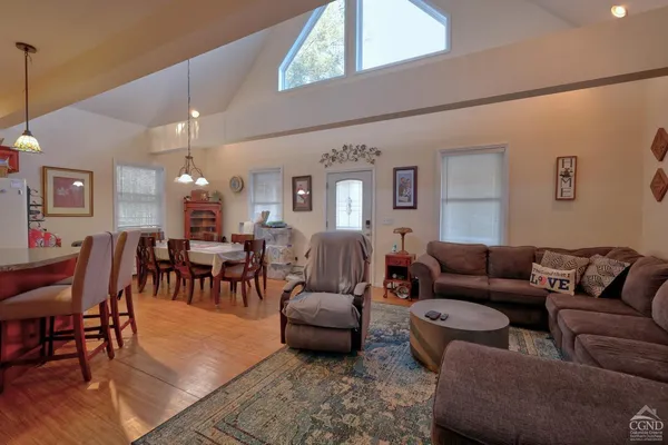 a bedroom with furniture and a window
