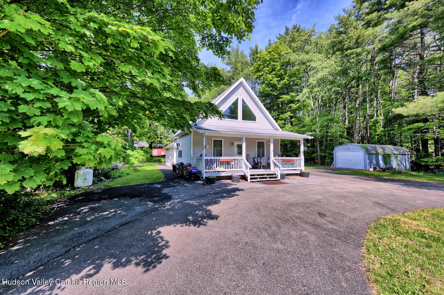 49 County Rte 39 Cairo, NY 12473 - Photo 8 of 114 a front view of a house with swing plants and large trees