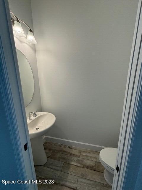 8326 Lyside Drive Melbourne, FL 32940 - Photo 6 of 17 a bathroom with a toilet and a sink
