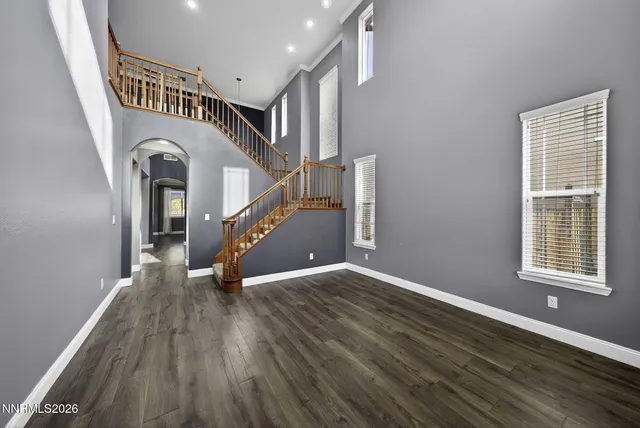 a view of entryway with stairs and wooden floor