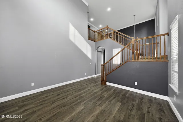a view of a kitchen with a sink and dishwasher a refrigerator with wooden floor