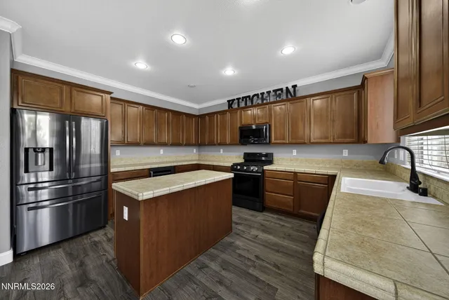 a bathroom with a granite countertop sink a large mirror and a shower
