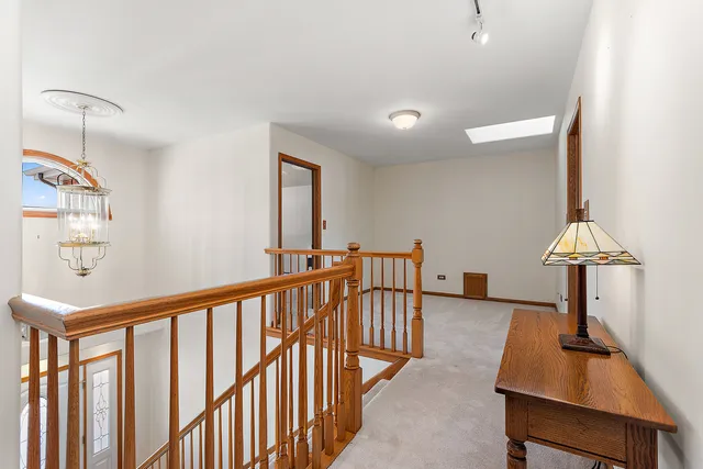 a view of a room with furniture and a window