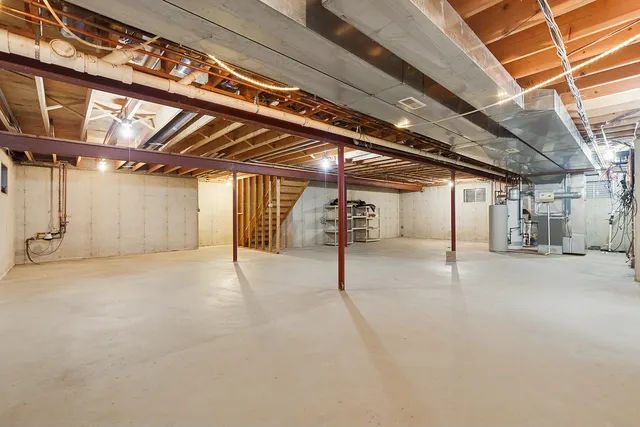 a view of empty room with wooden walls