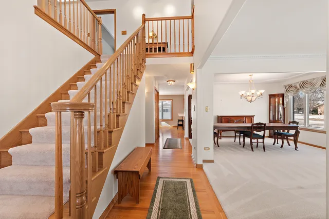 a view of dining room with furniture and stairs