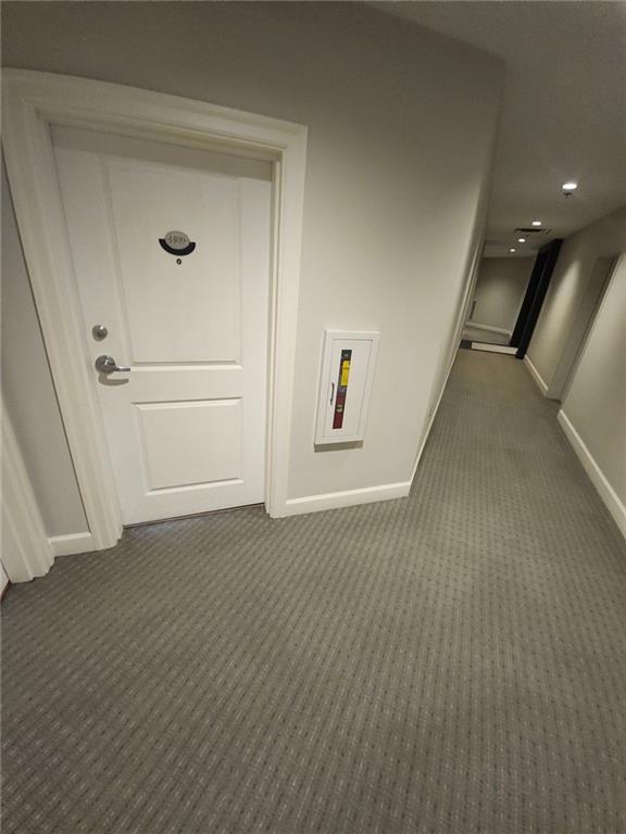 325 East Paces Ferry Road Northeast, Unit 1409 Atlanta, GA 30305 - Photo 2 of 14 a view of a hallway with wooden floor