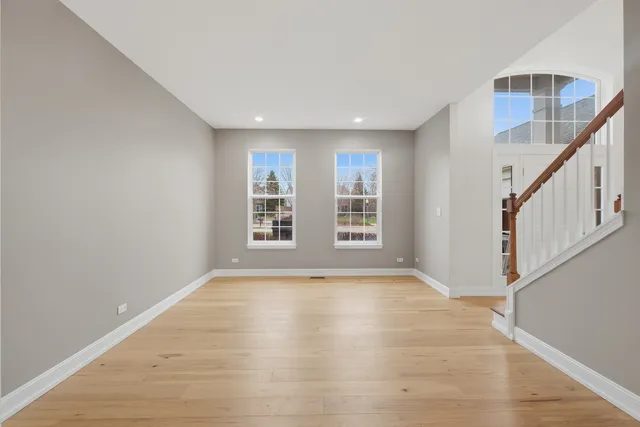 a view of an empty room with windows