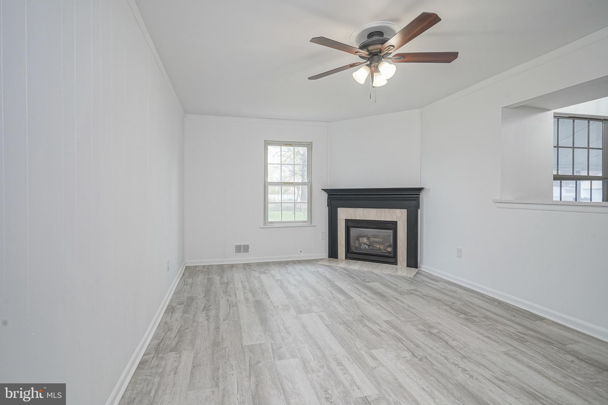 5 Wickham Lane Westampton, NJ 08060 - Photo 14 of 32 wooden floor fireplace and windows in an empty room