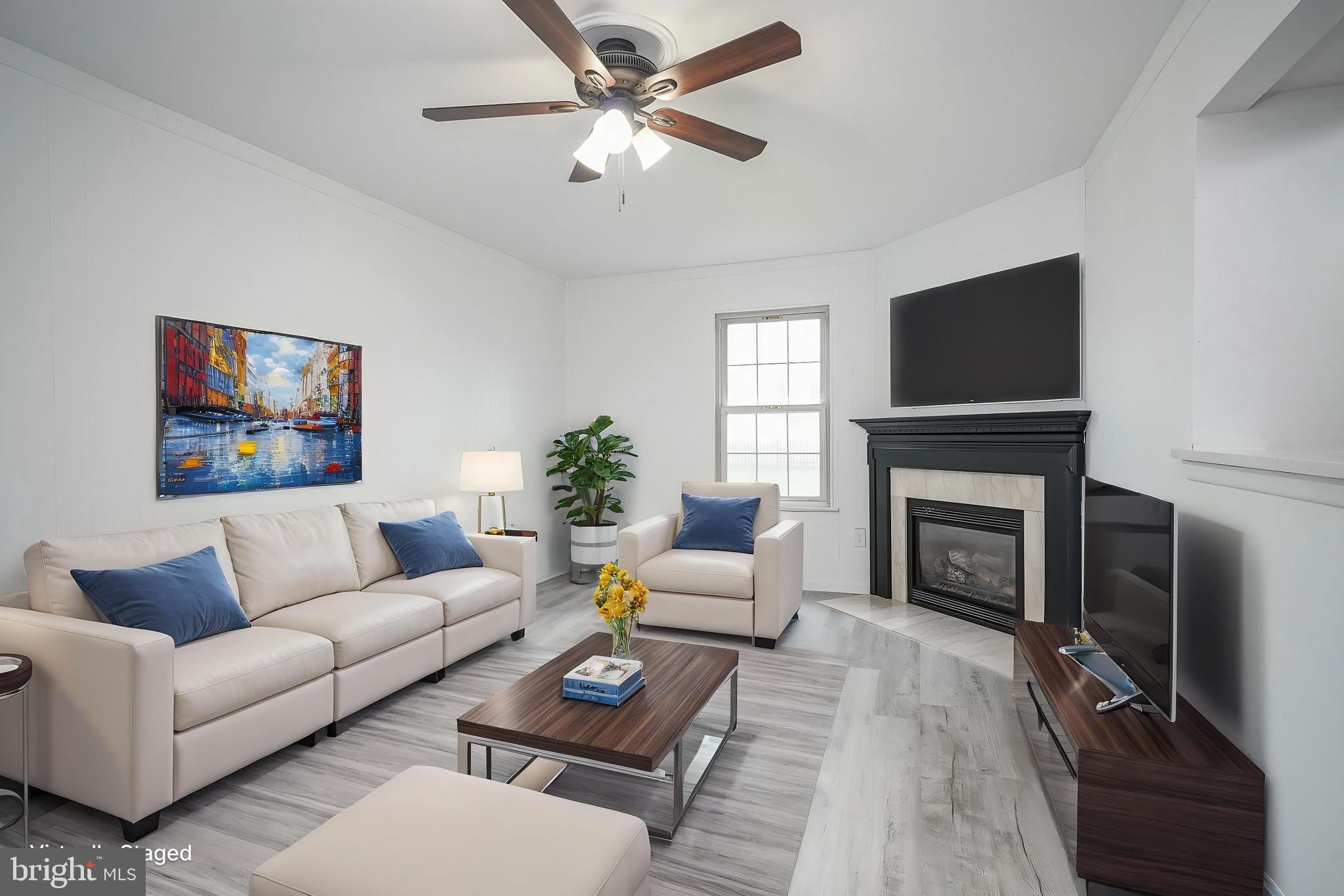 5 Wickham Lane Westampton, NJ 08060 - Photo 15 of 32 a living room with furniture a fireplace and a flat screen tv