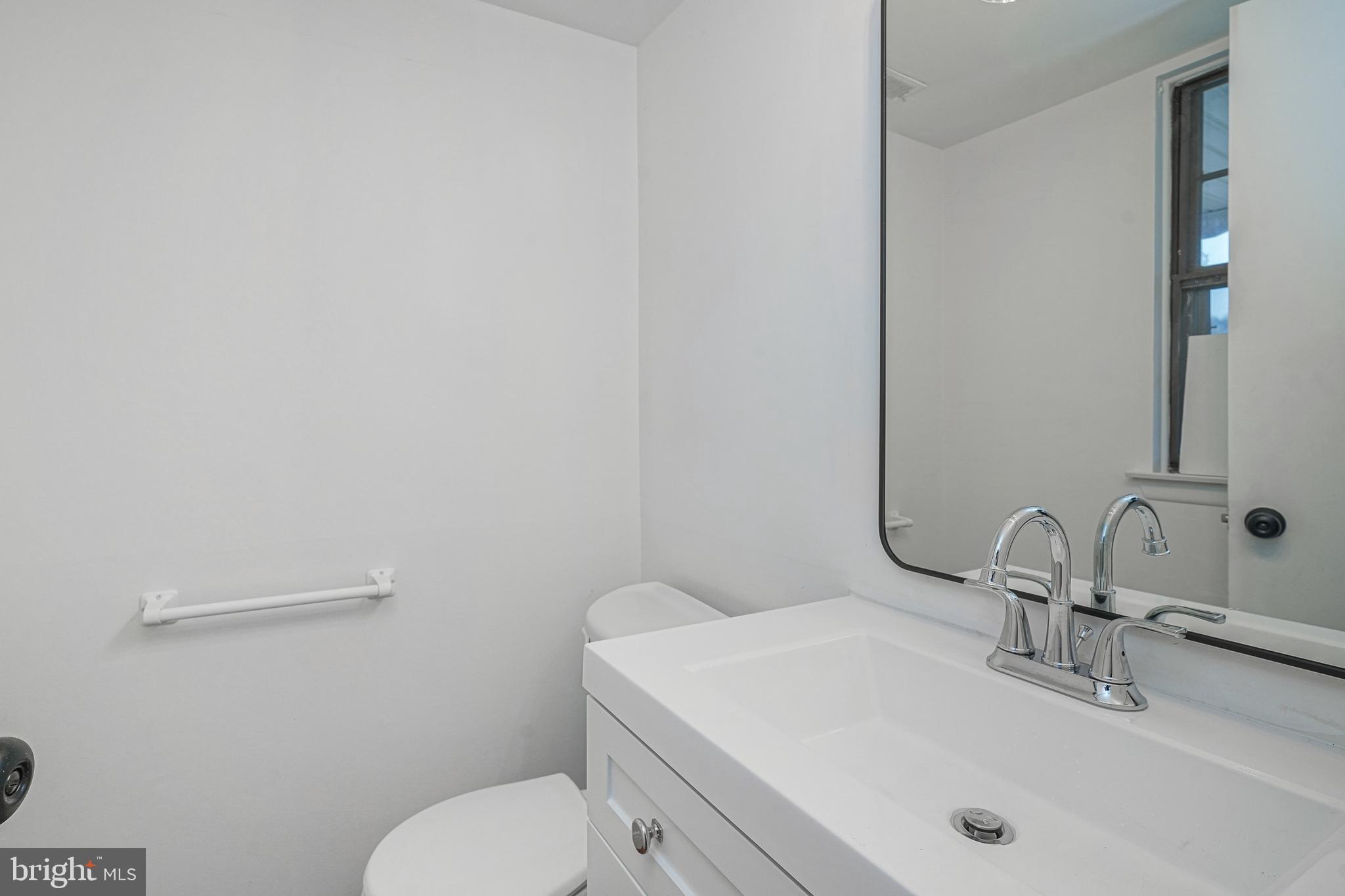 5 Wickham Lane Westampton, NJ 08060 - Photo 16 of 32 a bathroom with a sink a toilet and mirror