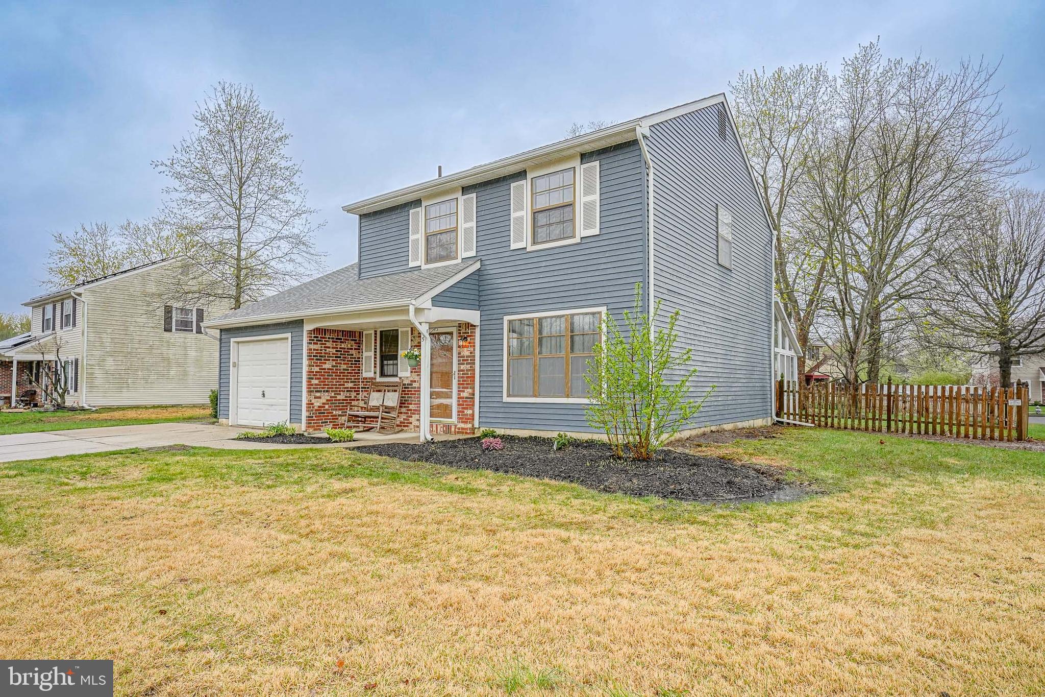 5 Wickham Lane Westampton, NJ 08060 - Photo 2 of 32 a view of a house with a yard and garage