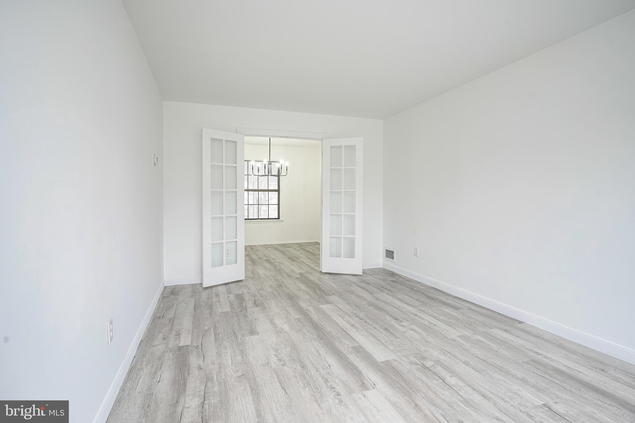5 Wickham Lane Westampton, NJ 08060 - Photo 6 of 32 an empty room with wooden floor and windows